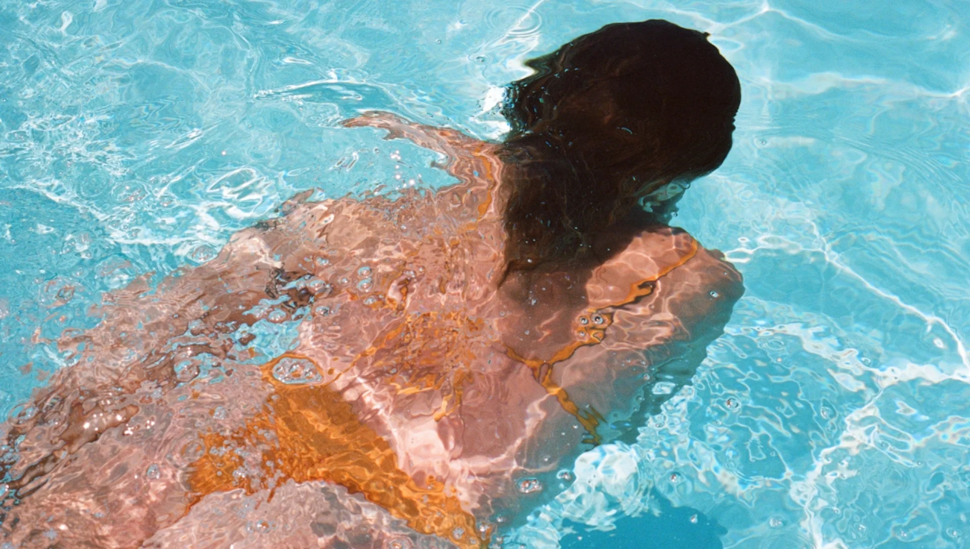 Woman swimming in the pool